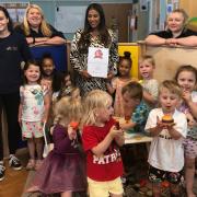 Staff and children at the nursery celebrate their award