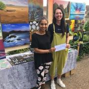 Polly Reehal awards a prize to artist Ruta Rendy
