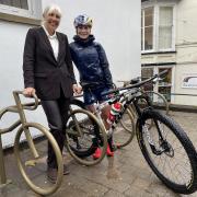 Cllr Beverley Nielsen and cyclist Evie Richards with the new bike rack