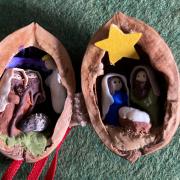 Miniature nativities including this one in a walnut are going on display in Malvern
