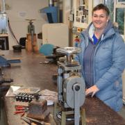 Anna Taylor and the silversmithing equipment