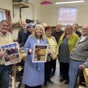 Harriett Baldwin MP (centre front) with volunteers and service users at Malvern Men’s Shed