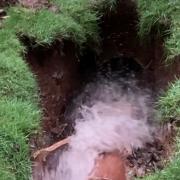 Water bursting from the sink hole.