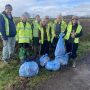 Harriett Baldwin MP (right) with litter-pickers with bags of rubbish in Clifton